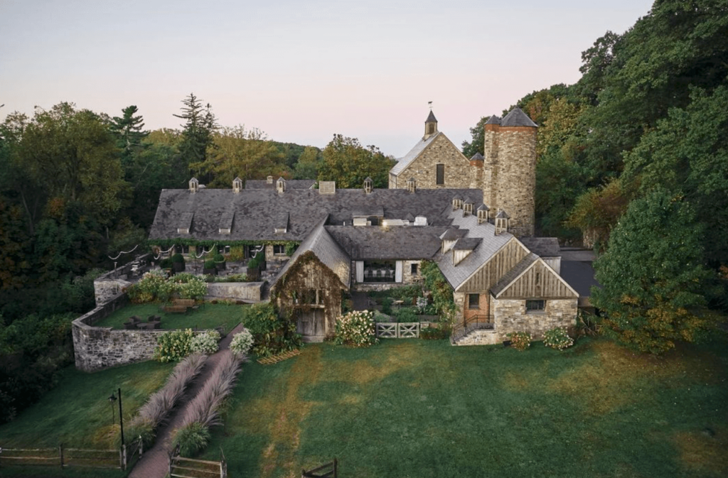 Drone view of the historic stone barn at Blue Hill Farm.